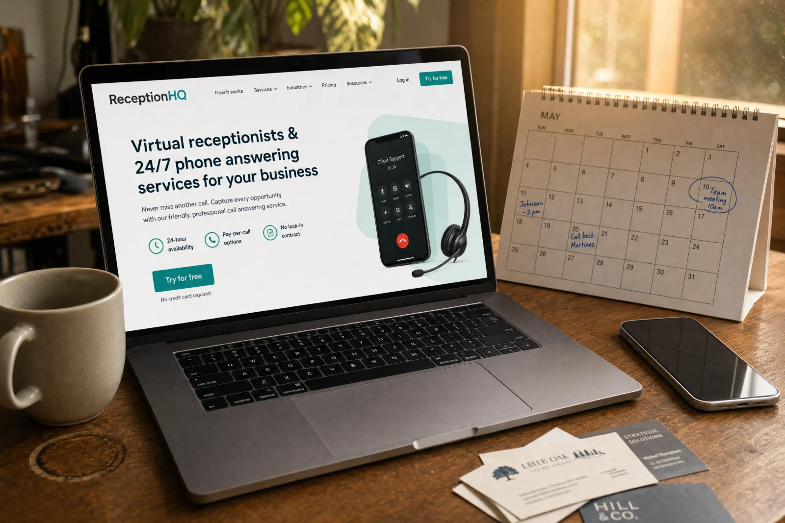 ReceptionHQ website displayed on laptop showing virtual receptionist and 24/7 answering services for contractors on desk.