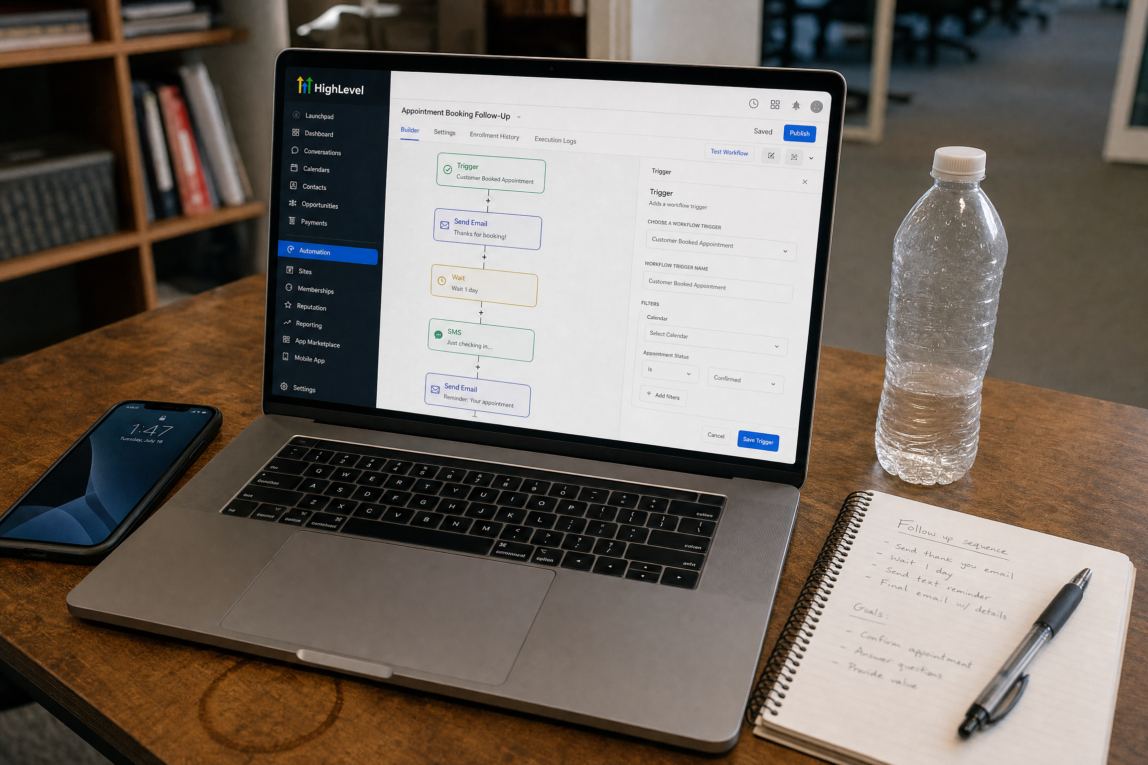 A laptop on a small business desk showing the GoHighLevel automation settings screen with a workflow configuration visible