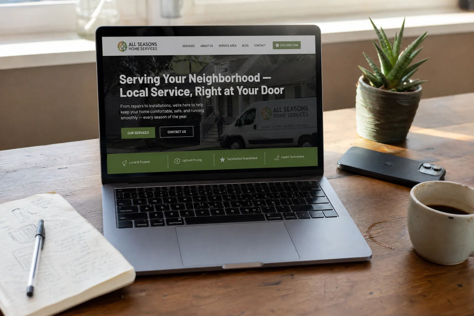 Laptop displaying small business website design service homepage with local service company branding and service offerings.