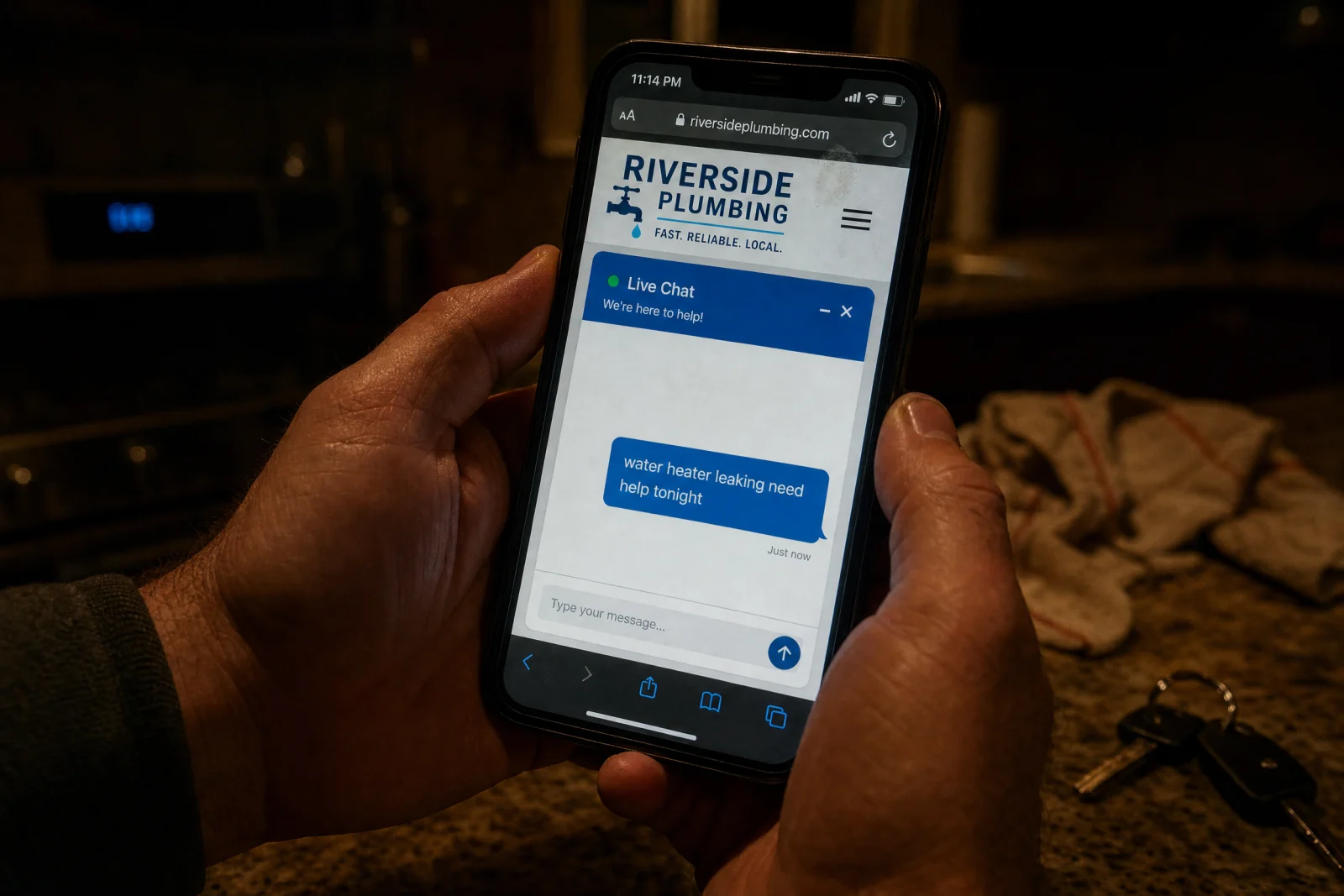 Person holding phone showing Riverside Plumbing website with after hours web chat at 11:14 PM
